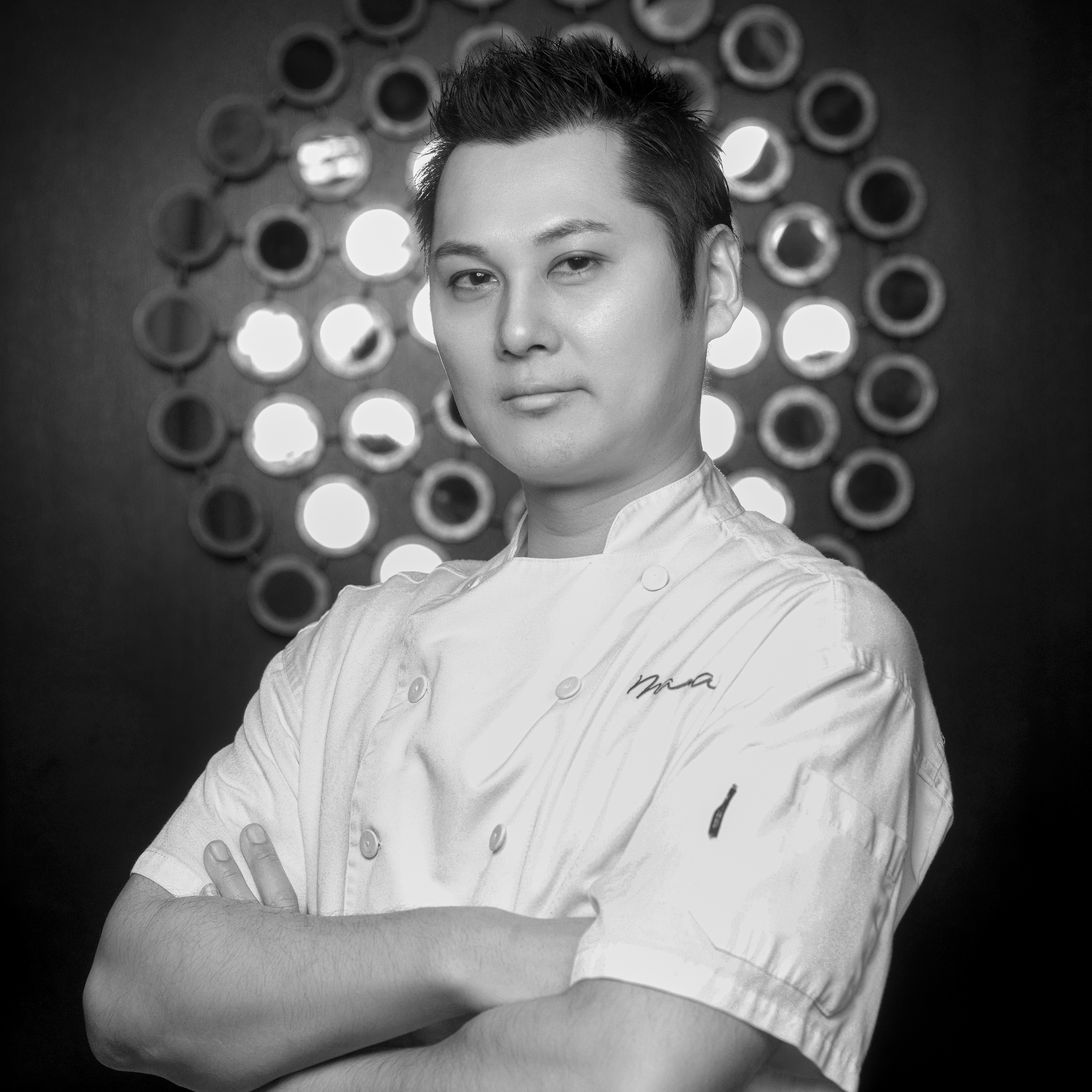 headshot of a man in a chef's coat